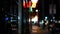 Defocused evening street. Lights of city, cars on rainy night. Road in soft focus. Twilight in USA.