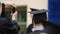 Defocused female graduate posing for picture after receiving diploma, education