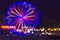 Defocused ferris wheel with colorful lights