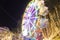 Defocused ferris wheel with colorful lights, Blur abstract background ready for your design