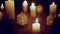 Defocused glowing candles and blinking decorative houses