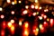 Defocused glowing shiny colorful christmas sparkles with reflections on dark