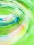 Defocused green motion blur swirling background.Colourful vortex blur green background