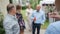 Defocused: Group of people celebrating and anddrinking cocktails