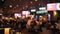 Defocused group of people handing over answers during a bar quiz game at pub