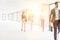 Defocused image of business people walking in new office