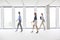 Defocused image of businesswomen walking in empty workspace
