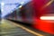 Defocused image of a modern train in motion.high-speed train passes by the platform