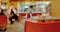 Defocused Interier with customers. People inside mall food court.