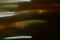 Defocused lights leak green orange smeared strokes