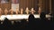 Defocused lineup of female fitness models showing muscular bodies on stage