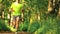 Defocused male athletic runner running in the park