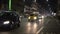 Defocused Milano traffic lights and cars at night