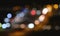 Defocused night traffic lights from cars. Abstract blur background.