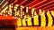 Defocused old fasioned electric lamps glowing at night. Abstract close up of blurred retro casino decoration shimmering
