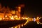 Defocused photo of Old town in Gdansk at night for greeting card background. The riverside on Granary Island reflection