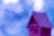 Defocused photo with a silhouette of a house on a blue bubble background. Space for lettering and design