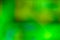 Defocused photography in emerald and green tones. Abstract blurred background. Space for lettering or design