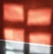 Defocused red and gray window reflections