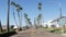 Defocused road with palm trees in California, tropical ocean beach. Los Angeles Hollywood aesthetic.