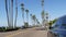 Defocused road with palm trees in California, tropical ocean beach. Los Angeles Hollywood aesthetic.