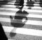 Defocused shadows of pedestrians crossing the street