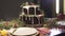 Defocused shot of excellent Christmas dinner table gingerbread cake in New Year eve cozy decoration festive atmosphere
