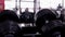 Defocused silhouette of male athlete doing bench press exercise in the gym