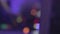 Defocused silhouette of male DJ playing music at night club. Lifestyle. Party