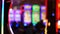 Defocused slot machines glow in casino on fabulous Las Vegas Strip, USA. Blurred gambling jackpot slots in hotel near