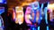 Defocused slot machines glow in casino on fabulous Las Vegas Strip, USA. Blurred gambling jackpot slots in hotel near