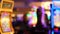 Defocused slot machines glow in casino on fabulous Las Vegas Strip, USA. Blurred gambling jackpot slots in hotel near