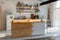 Defocused spacious open space loft industrial  kitchen studio interior with kitchen appliances filled with sunlight