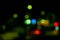 defocused traffic lighting light balls with various colors in random positions.