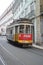 Defocused Tram Passing At Full Speed By Misericordia Street In Lisbon. Nature, Architecture, History, Street Photography. April 11