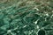 defocused turquoise bermudas water background with ripples. defocused turquoise ripple water