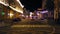 Defocused view of a busy city street. Night. Heavy traffic. Colorful buildings