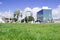 Defocused view of city buildings from, grassed area on Tauranga