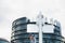 Defocused view of European Parliament building with steel street pole