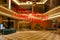 Defocused view of interior of an upmarket hotel reception, empty and closed due to coronavirus