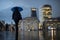 Defocused view of London at twilight with silhouettes of people