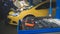 Defocused view - mechanic repairs a car - unscrews detail of automobile - garage service