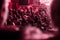 Defocused viva magenta. Color of the year 2023. Pantone. spectators sit in the hall and watch a concert. People in the