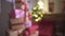 Defocused wonderful view on wrapped Christmas gifts presents pile in New Year tree in decorated festive atmosphere room