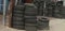 Defocusing Foto and zoom in. Stacked used auto tires in the car service center, next to the highway