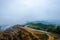 Deforestation land at mountain area with low clouds after rain in Gua Musang, Kelantan, Malaysia