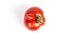 Deformed red tomato on a white background