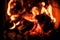 Defused abstract image. three burning billets in hot stove.Fire flame burning coal and wood in fireplace.Hot coals in