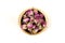 Dehydrated pink rose buds in a ceramic bowl top down view