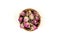 Dehydrated pink rose buds top down view in a small wooden bowl